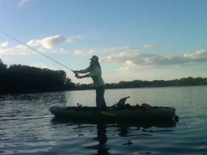 woman stand up fly fishing
